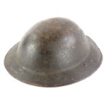 A WWI period B model Brodie metal helmet, indistinctly signed stamped, strap, 31.5cm x 21.5cm.