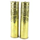 A pair of tall embossed brass Trench Art vases, engraved for Ypres 1914 and Yser 1918, the shells be