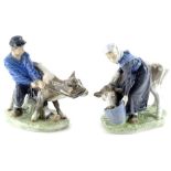 A pair of Royal Copenhagen porcelain figure groups, each modelled in the form of a Farmer, and a Far
