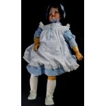 An Armand Marseille German bisque headed doll, numbered 390 and 14, with composition limbs, 74cm hig