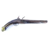 An early 19thC Eastern pistol, the steel barrel indistinctly engraved with various motifs, possibly