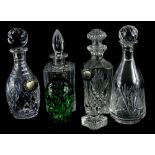 A collection of four late 20thC cut glass decanters, to include square section examples, with three