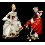Two Royal Doulton figurines, Country Rose and Autumn Breezes, and a Royal Doulton figure of a spanie
