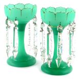 A pair of Victorian green frosted opaque glass table lustres, each with gilt decoration, some damage