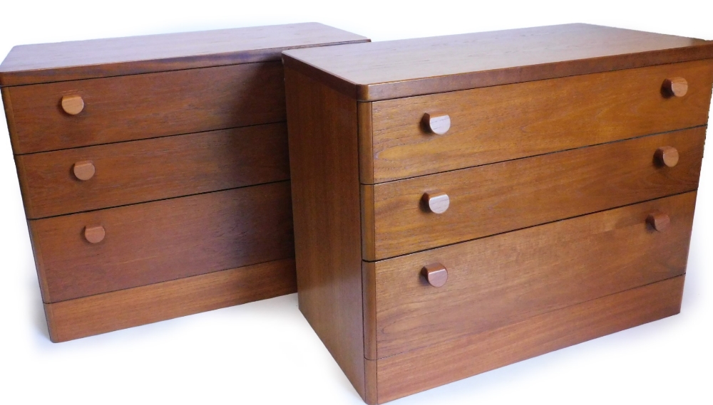 A pair of Stag teak chests of drawers, each with rounded corners above three graduated drawers, with