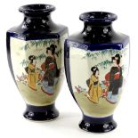 A pair of 20thC Japanese Satsuma type vases, each decorated with figures, on a dark blue ground, 25c