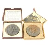 Two cast metal Lusitania propaganda medals, boxes AF.
