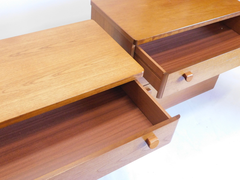 A pair of Stag teak chests of drawers, each with rounded corners above three graduated drawers, with - Image 2 of 2