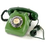 A 1962 GPO green telephone, unusually fitted with a chrome dial and handle, bell on/off switch.