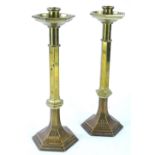 A pair of ecclesiastic type brass Gothic candlesticks, each of octagonal form, engraved to the base