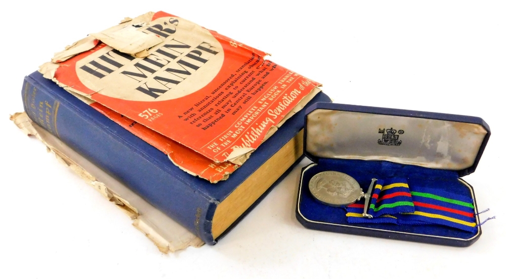 A cased Civil Defence long service medal in fitted box, 12cm wide, and Hitler (Adolf) Mein Kampf in