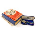 A cased Civil Defence long service medal in fitted box, 12cm wide, and Hitler (Adolf) Mein Kampf in