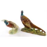 A Beswick pottery model of a pheasant, impressed and printed marks to underside, number 1225, and an