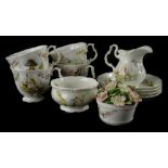 A collection of Royal Albert World of Beatrix Potter porcelain, to include cups, saucers, cream jug