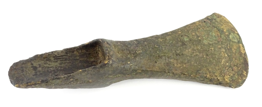 A Bronze Age bronze axe head with double socket, 15.5cm long. Provenance: Discovered during excavat