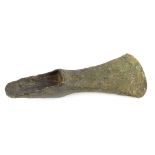 A Bronze Age bronze axe head with double socket, 15.5cm long. Provenance: Discovered during excavat