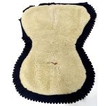 A military Hussars sheepskin shabraque, numbered to interior 08/028, with fabric border.