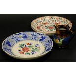Three similar Staffordshire saucer dishes, each decorated with flowers and a Victorian copper lustr