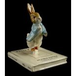 A John Beswick 100th Anniversary of the Tale of Peter Rabbit figure group, Peter and his Book, boxed