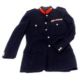 A post war British officer's tunic, with two ribbon bands and dispatches oak leaf.