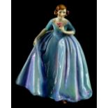 A Royal Worcester porcelain figurine The Duchess's Dress, modelled by Freda Doughty, the dress with