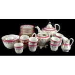 A 19thC porcelain part tea service, decorated with bands in pink and gilt, unmarked.