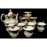 A Royal Crown Derby Old Country Roses part tea service, to include teapot and cover, six cups, sauce
