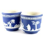 A pair of Adams dark blue Jasperware jardiniere, each decorated with hunting scenes, impressed marks