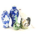 Miscellaneous oriental items, to include a blue and white vase decorated with buildings, etc., a pru