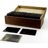 A collection of glass negatives or magic lantern slides, each depicting late 19th/early 20thC figure