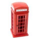 A modern novelty red telephone box, with pierced door to house a modern phone, 41cm high.