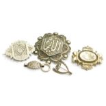 Four silver brooches, to include a Middle Eastern brooch, with filigree type design and lettering