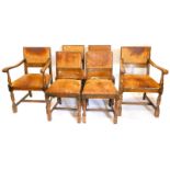 A set of six oak dining chairs, each with a brown leather padded back and seat, on part turned legs,