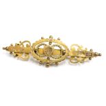 A Victorian 9ct gold sweetheart brooch, with shield and scroll design, Birmingham 1893, possibly by