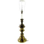 A 20thC brass table lamp, on turned stem with circular foot, with electrical feature, 83cm high.