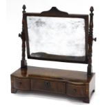 An early 19thC mahogany and boxwood strung dressing table mirror, rectangular plate, on part turned