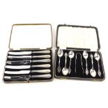 A set of six Arts and Crafts silver teaspoons, with matching sugar tongs, pierced and shaped handle,