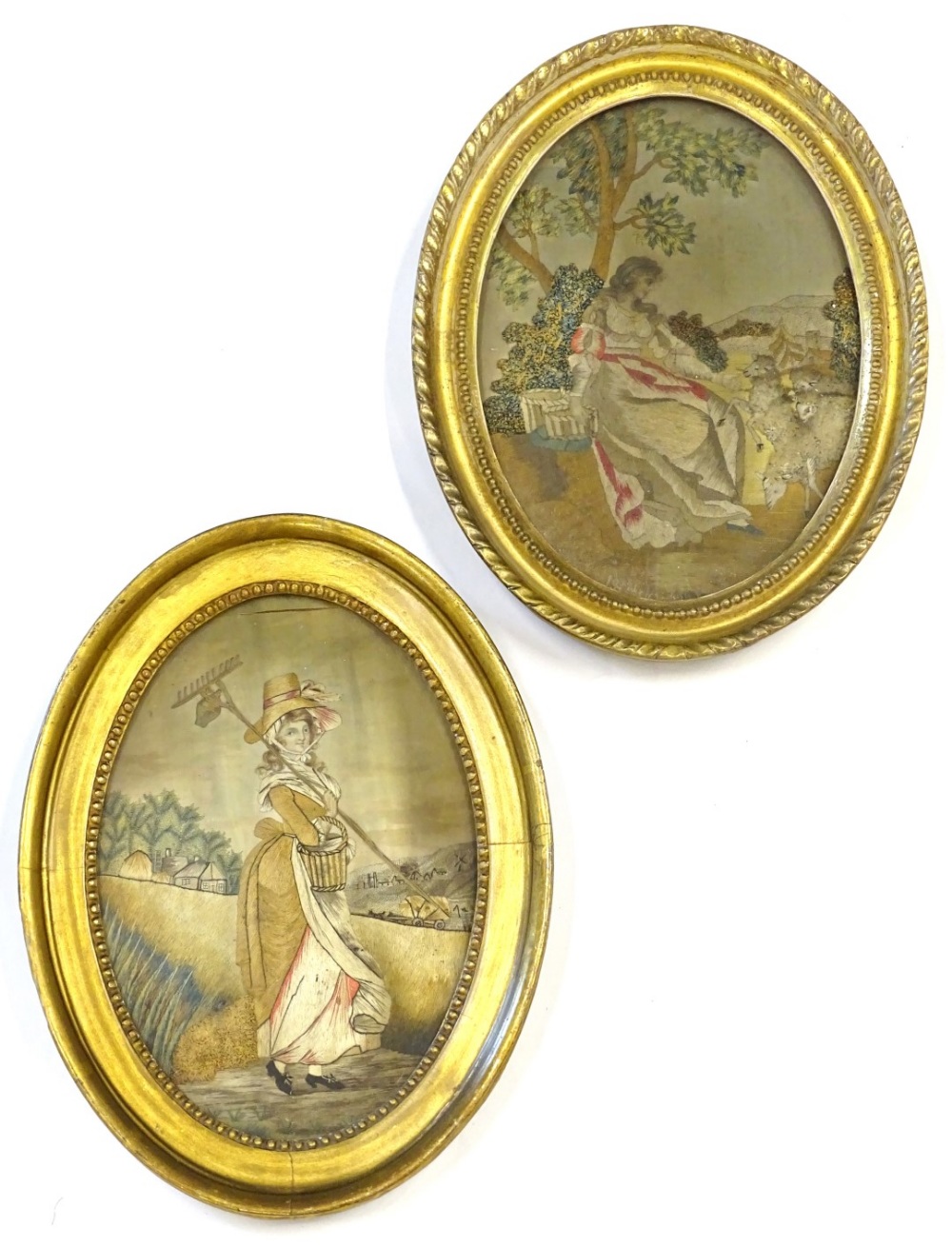 A pair of 19thC embroidered silk pictures, depicting lady sitting before a tree, another with a rake