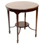 An Edwardian mahogany occasional table, the circular top with a moulded edge above a frieze carved w