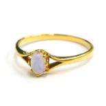 An opal dress ring, set with single small opal, with V splayed shoulders, yellow metal, marked 18ct,