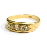 A diamond set gypsy ring, with five old cut diamonds, of graduated size the largest approximately 0.