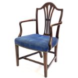 A George III mahogany open armchair, with a shield shape back with a pierced vase shape splat, with