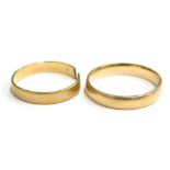 Two 9ct gold wedding bands, one cut, the other ring size S½, 4.6g.