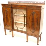 An early 20thC mahogany and inverted breakfront side cabinet, top with a pierced fret-carved gallery