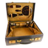 A George V leather dressing case, with a fitted interior containing simulated tortoiseshell dressing