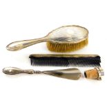 Various silver mounted items, to include a shoe horn, a bottle stopper, a brush and a comb.