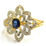 An 18ct gold sapphire and diamond floral cluster ring, the cluster ring head set with tiny white dia