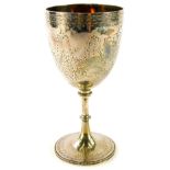 A Victorian silver goblet, with bright cut decoration of swags, scrolls, etc., engraved centrally Th