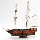 A wooden model of the two masted ship the Portsmouth, with six cannon to each side, including base,