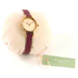 A Radley London ladies wristwatch, with small circular pale pink watch head on fuchsia strap, with o